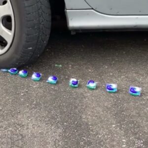 Car passing over oranges, iPhones, soft drinks