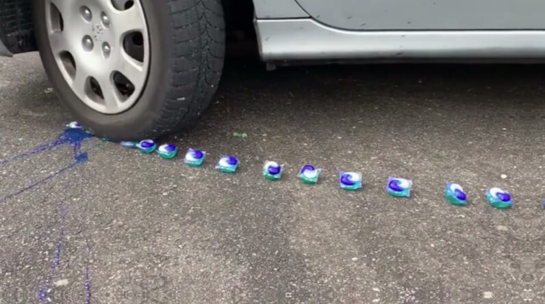 Car passing over oranges, iPhones, soft drinks